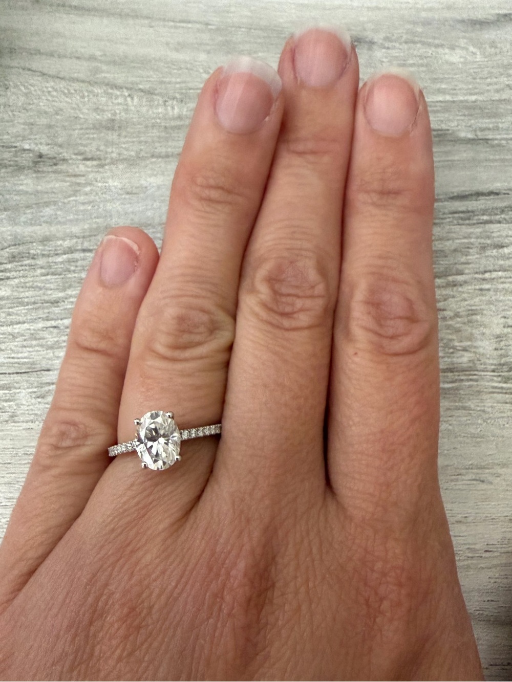 Oval Solitaire Engagement Ring in White Gold with Pavé Band